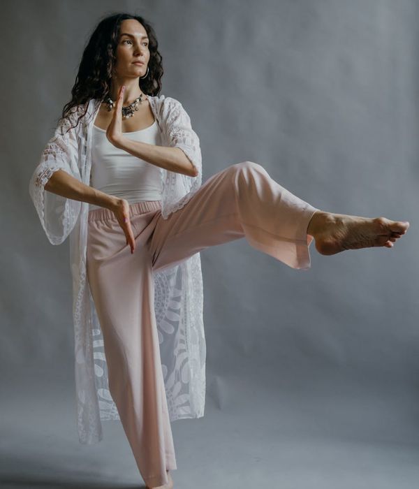 Person practicing gentle movements for inner balance and focus